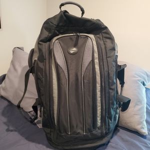 American Tourister 24" rolling Duffel bag in black/gray. Worn but good condition